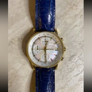 DKNY watch. Gold color. Two extra bands included. Bands are fossil brand